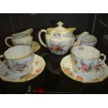 A Royal Crown Derby tea for two set in the Derby poses pattern, (one saucer cracked).