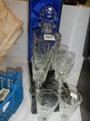 A cut glass decanter and a set of six glasses.