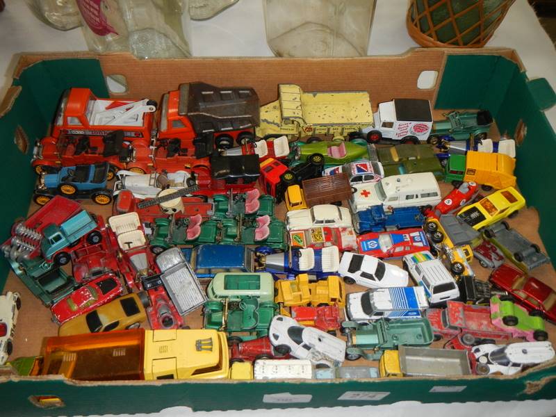 A large box of Matchbox, Corgi and Dinky die cast vehicles.