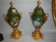A pair of porcelain and gilt lidded urns, COLLECT ONLY.