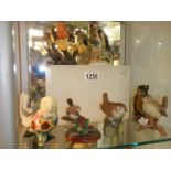 Eight assorted bird figures, various makers.
