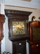 A carved oak 8 day Grandfather clock with brass dial, COLLECT ONLY.