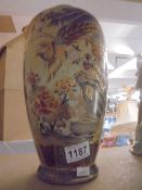 A Japanese hand painted vase featuring birds.