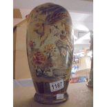 A Japanese hand painted vase featuring birds.