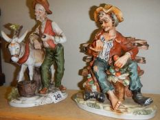 Two Capo-di-monte style tramp figures.