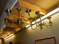 A pair of brass ceiling lights.