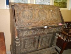 RESTORATION PROJECT - A late 19th century carved oak bureau. COLLECT ONLY.