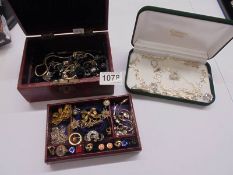 Two jewellery boxes and a good lot of costume jewellery.