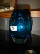 A blue studio glass vase.