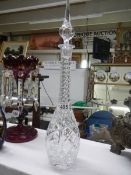 A tall cut and engraved glass decanter. COLLECT ONLY.