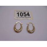 A pair of 9ct gold earrings, 0.6 grams.