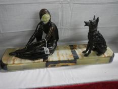 A French Art Deco figure with dog on a marble base, COLLECT ONLY.