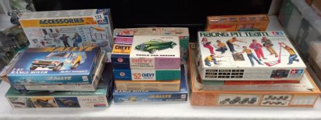 A quantity of boxed model kit vehicles etc including Airfix Revell and Tamiya
