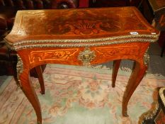 A marquetry inlaid fold over games table, COLLECT ONLY.