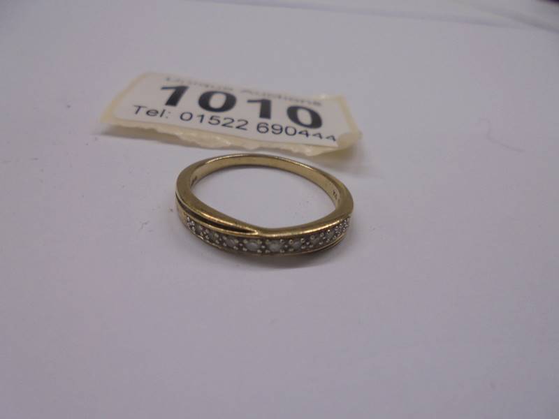 A yellow gold half carat diamond ring, size P, 1.95 grams.