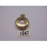 A gold plated half hunter pocket watch, Elgin USA, in working order.