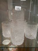 A Whitefriars snowflake set comprising jug and four tumblers, M171 design.