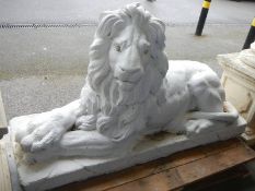 A large garden sculpture of a reclining lion, COLLECT ONLY.