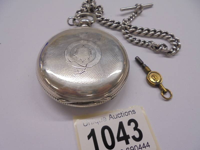 A silver pocket watch, John Jenkinson 40425 on silver Albert chain with key, in working order. - Image 3 of 4