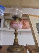 An oil lamp with brass base, hand painted glass font and acid etched shade, COLLECT ONLY.