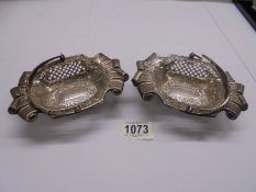 A pair of silver hall marked bon bon baskets, maker C A F Birmingham, (one handle a/f).