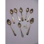 Eight silver teaspoons, approximately 4 ounces. (124 grams).