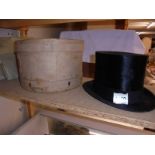 A boxed top hat by Dunn & Co.,