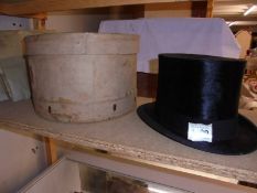 A boxed top hat by Dunn & Co.,