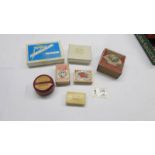 A mixed lot of boxes including pin box with contents, match boxes etc.,