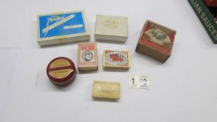 A mixed lot of boxes including pin box with contents, match boxes etc.,