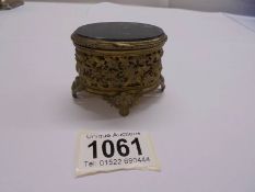 An early 20th century French trinket box with glass top.
