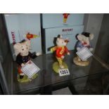 Three boxed Royal Doulton Rupert figures.