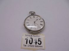 An old pocket watch marked 'Examined by Dent, London'