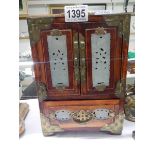 An oriental style jewellery cabinet.