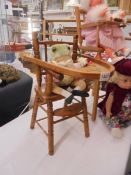 A dolls high chair with Beatrix Potter frog. COLLECT ONLY.
