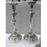 A pair of silver plate candlesticks.