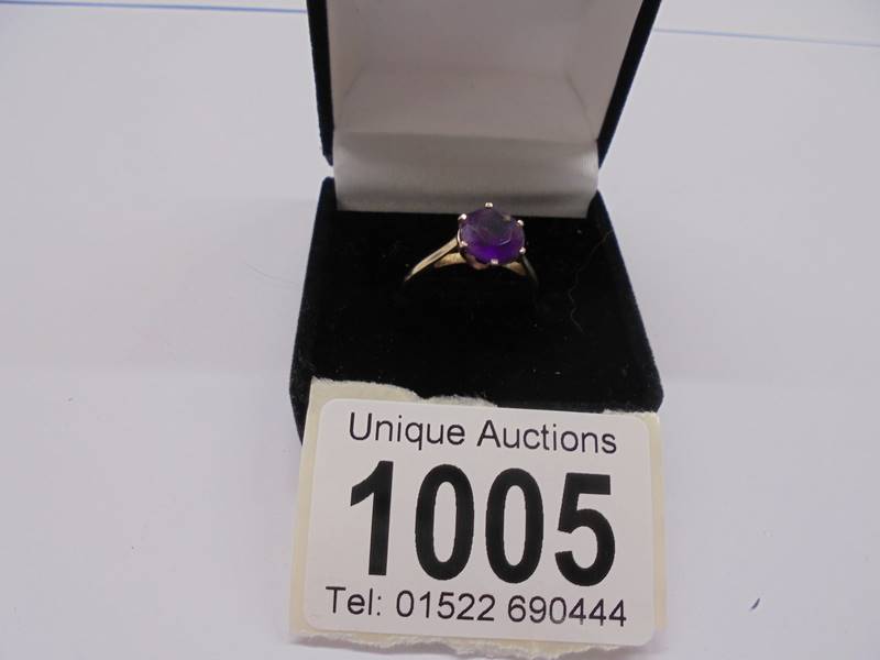 An American 10ct gold amethyst ring, size L, 1.78 grams.