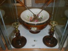 A mid 20th century oak salad bowl with servers and a pair of oak candlesticks.