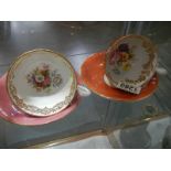 Two Aynsley tea cups and saucers.