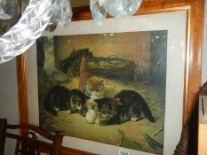 A framed and glazed print of kittens playing with an egg in a barn, COLLECT ONLY.