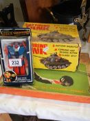 A boxed Marx cap firing tank table tennis and a space warrior robot.