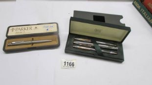 A Parker Roller Ball pen in case and a cased 'Cross' pen set.