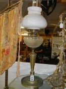 An oil lamp on brass base with glass font and shade. COLLECT ONLY.