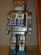 A vintage Japanese tin plate battery operated robot (working when tested).