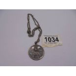 A silver St. Christopher with attached silver chain, 15 grams.