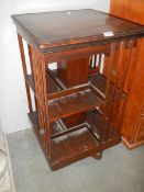 A mahogany revolving book case. COLLECT ONLY.