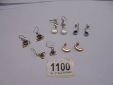 Four pairs of silver (925) earrings and an un-marked pair of earrings.