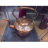 A copper kettle.