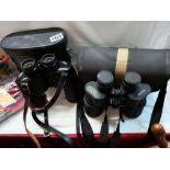 A cased set of Carl Ziess binoculars and one other.