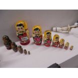Two sets of Russian nesting dolls.